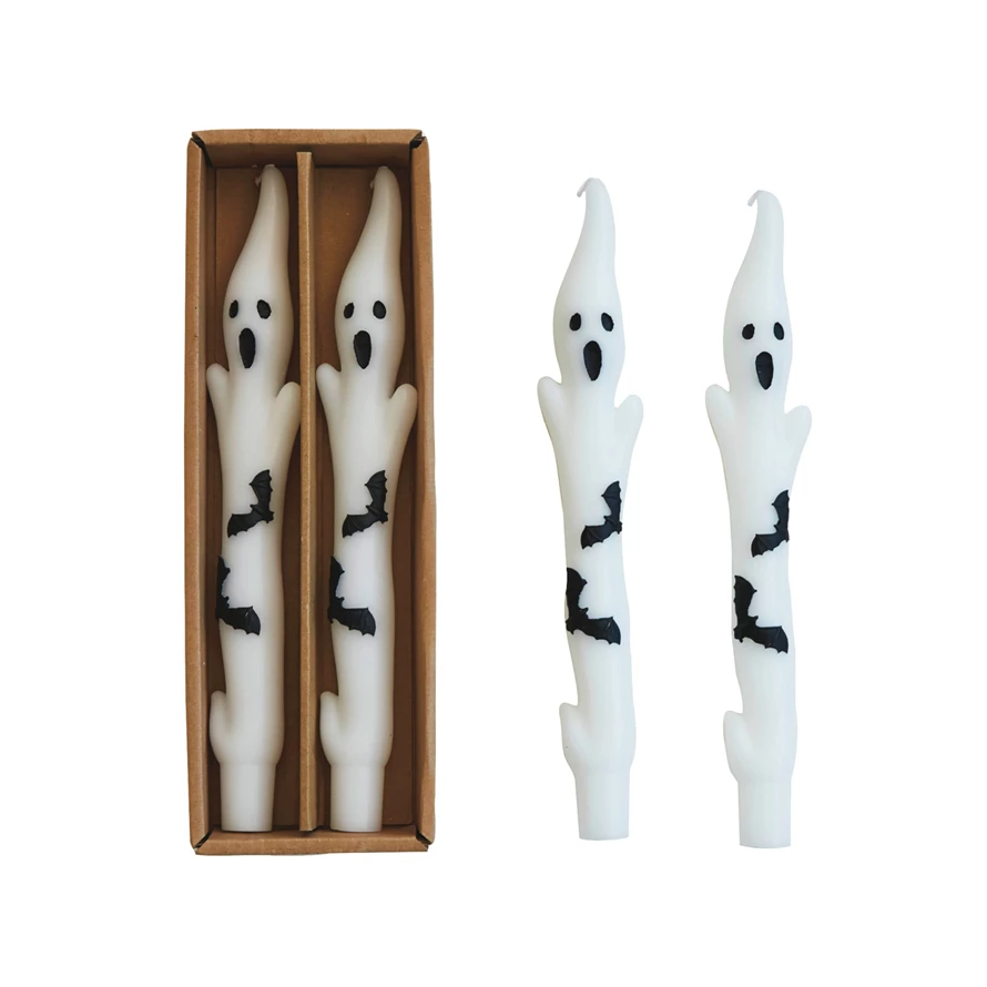 Boxed white tapered candles shaped like ghosts with black bat silhouettes.