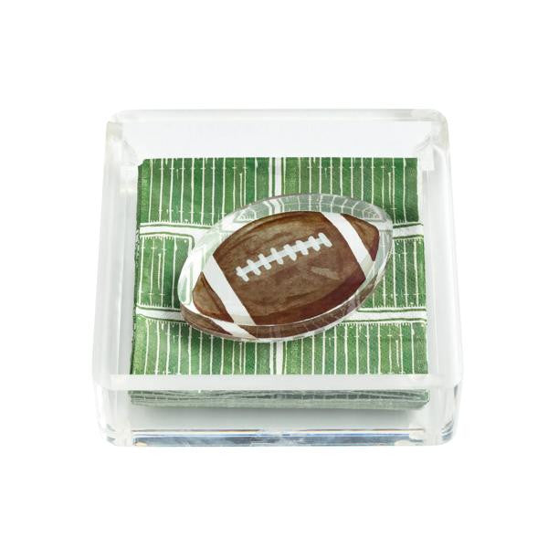 Clear acrylic napkin holder with green football field napkins and a football-shaped weight.