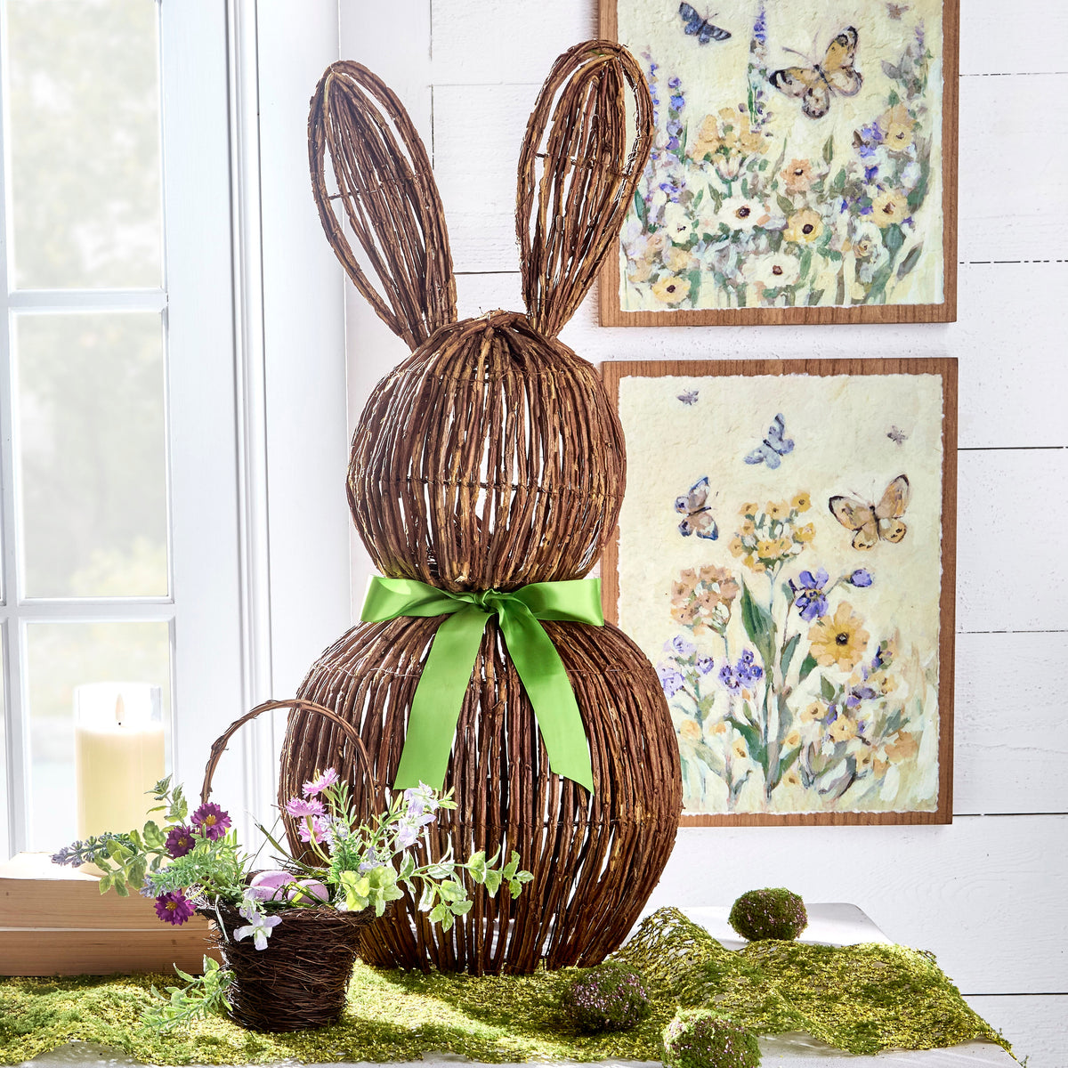 Wire rabbit figurine with a bow measuring 28 inches tall.
