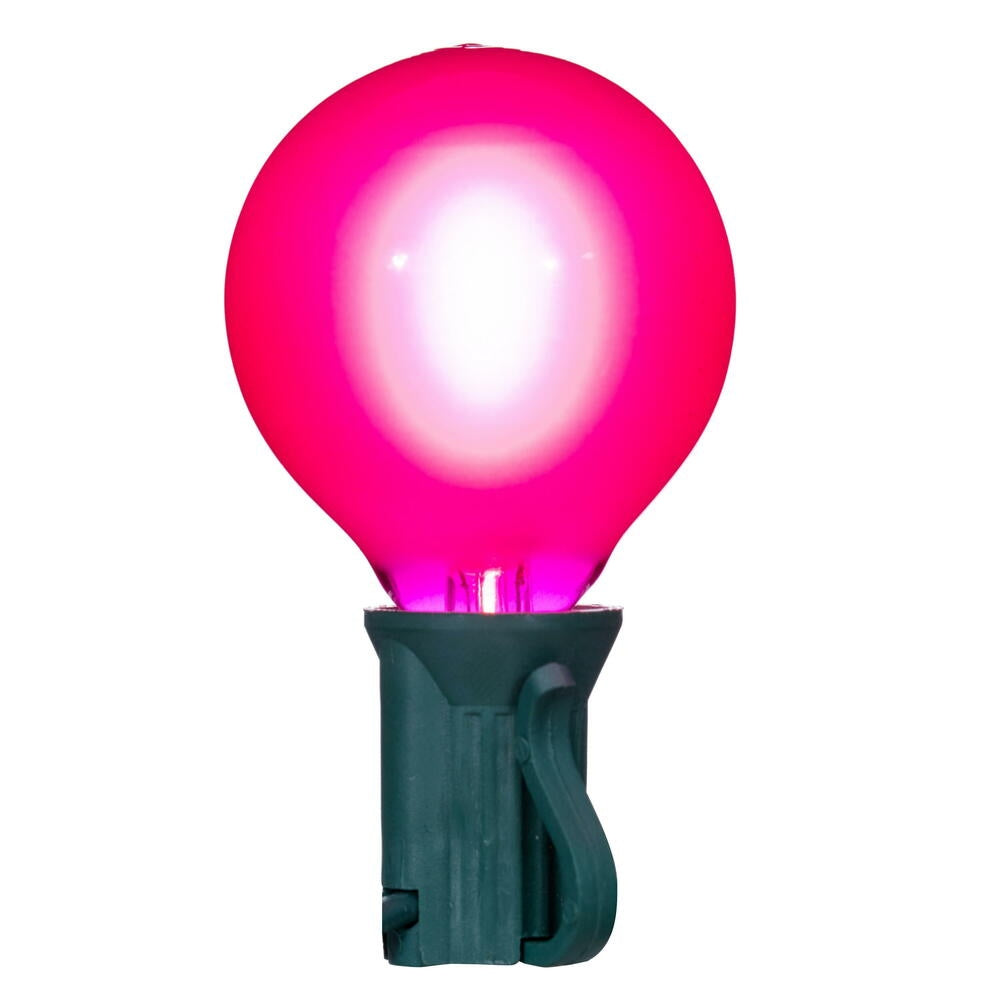 Pink LED filament glass replacement bulb in a green C7 socket base.