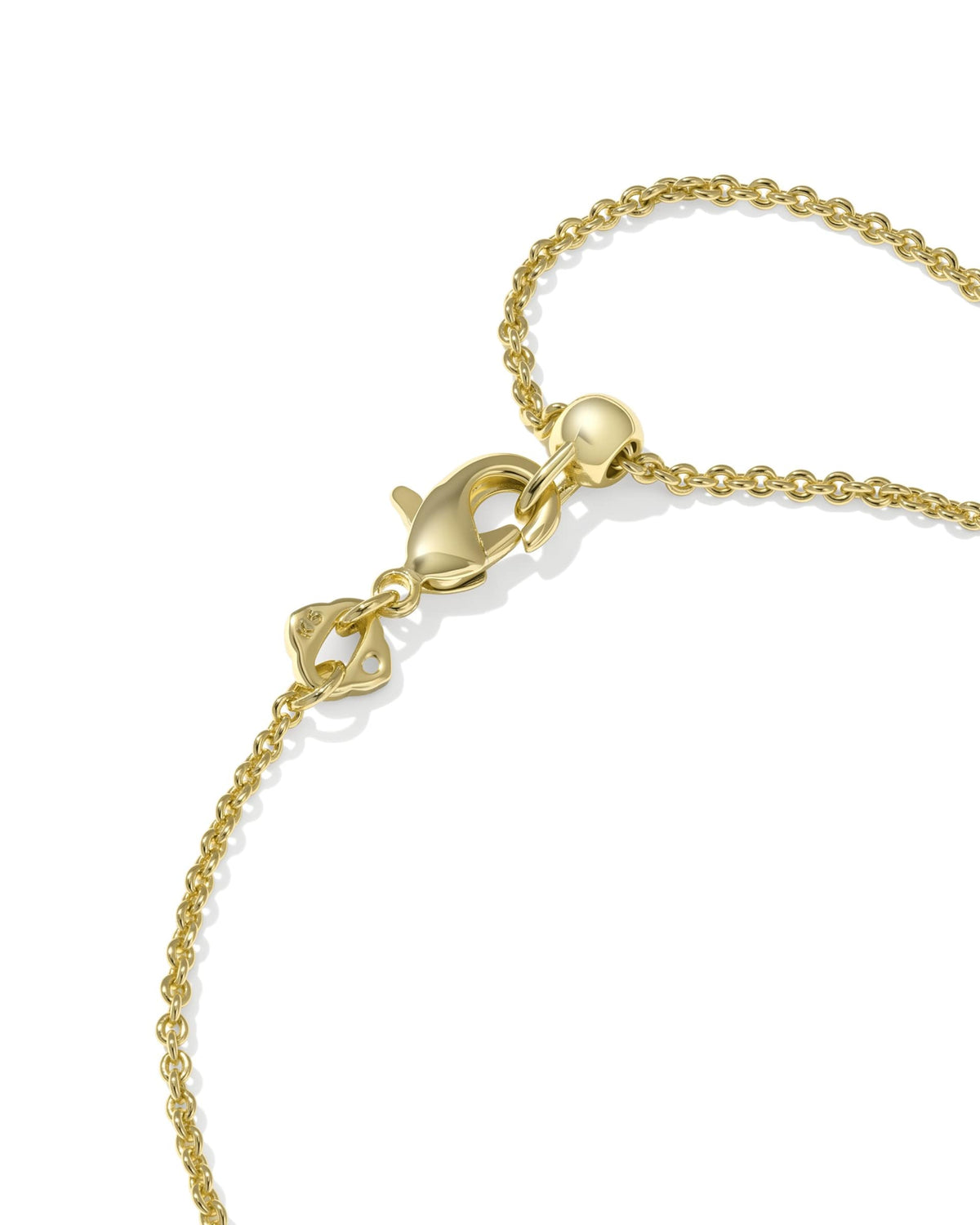 Delicate rhodium over brass chain bracelet featuring a white cubic zirconia cross pendant with an adjustable slider.
