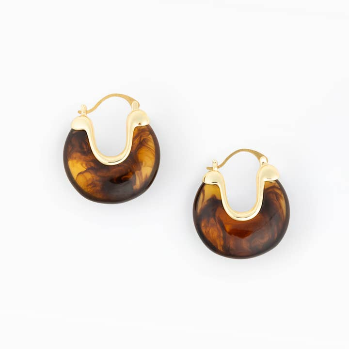 Mabel Earrings featuring a chunky tortoiseshell resin hoop with gold-plated brass accents.