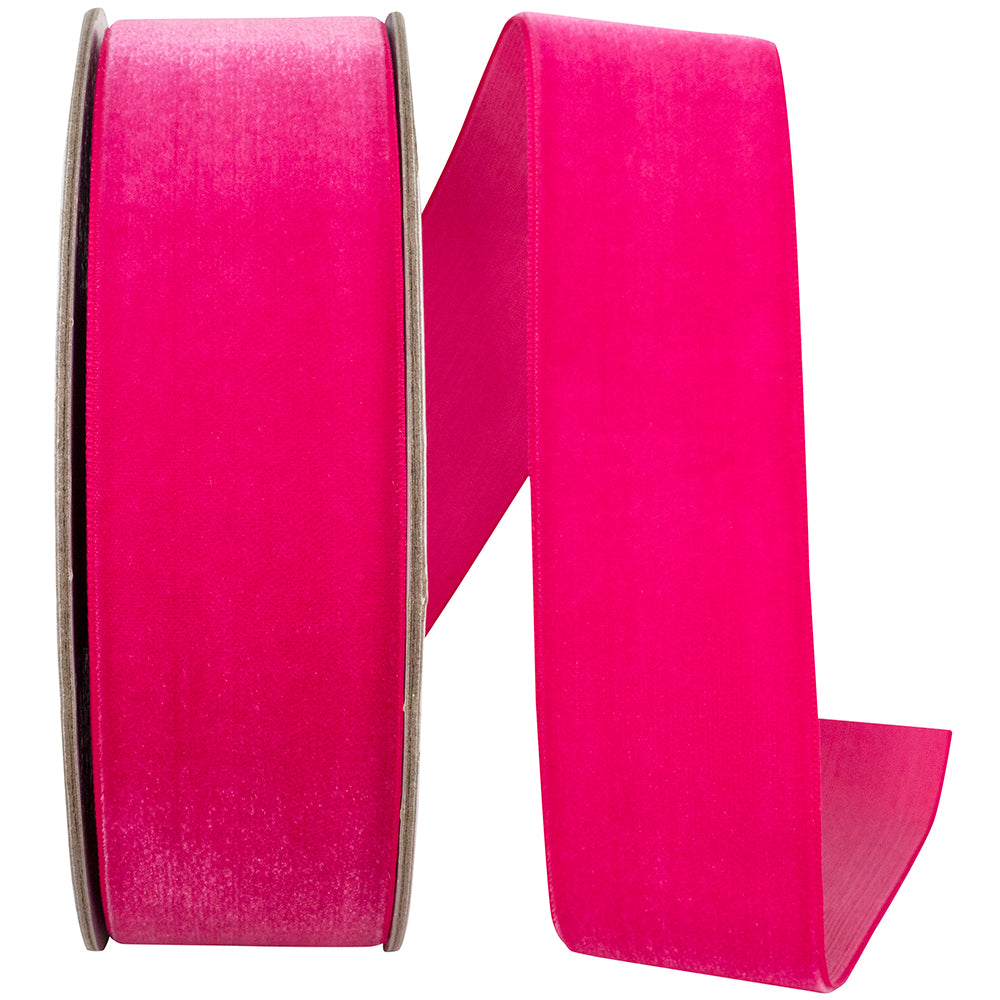 Roll of Azalea colored woven edge velvet fabric with a soft texture.