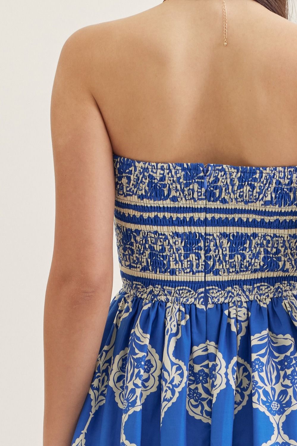Women's Gabrielle printed strapless midi dress in light blue cotton with smocked back and side pockets.
