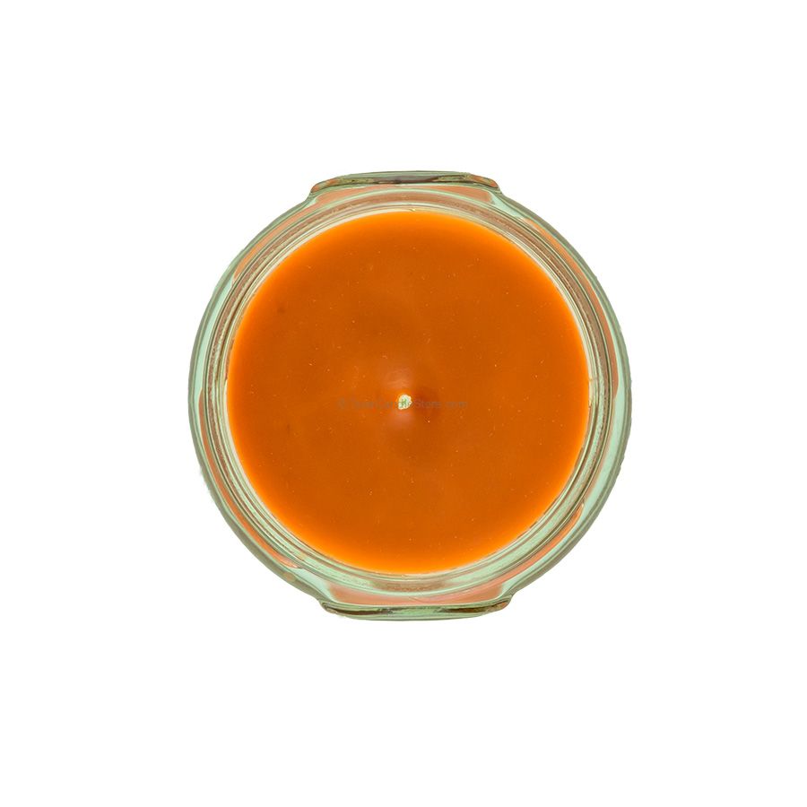 Top-down view of a 3.4oz Tyler candle in a glass jar with orange wax and a single centered wick.