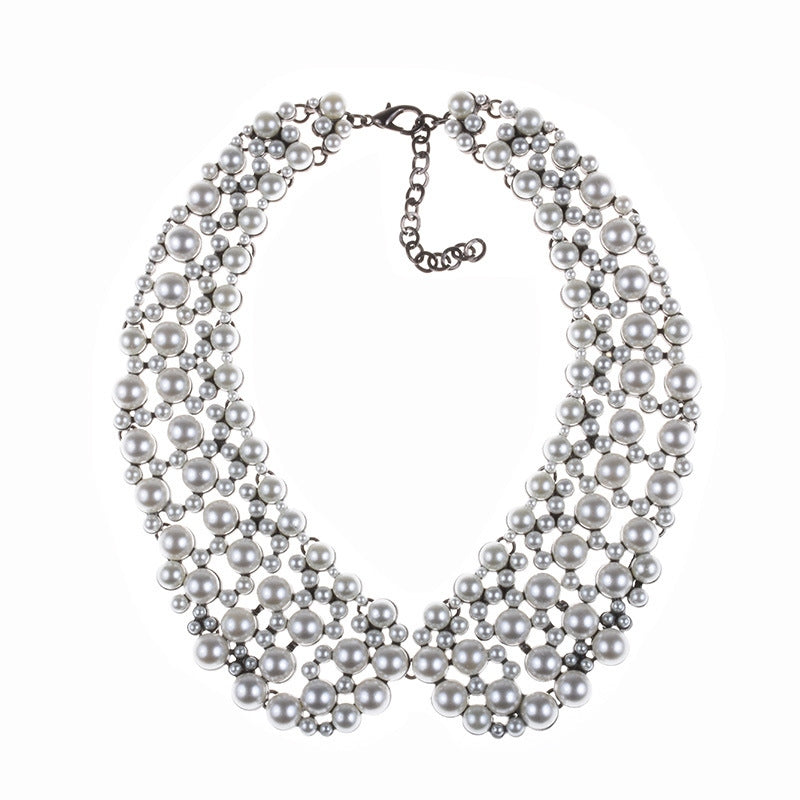 Exaggerated sparkling rhinestone collarbone chain necklace with a bib-style pearl design.