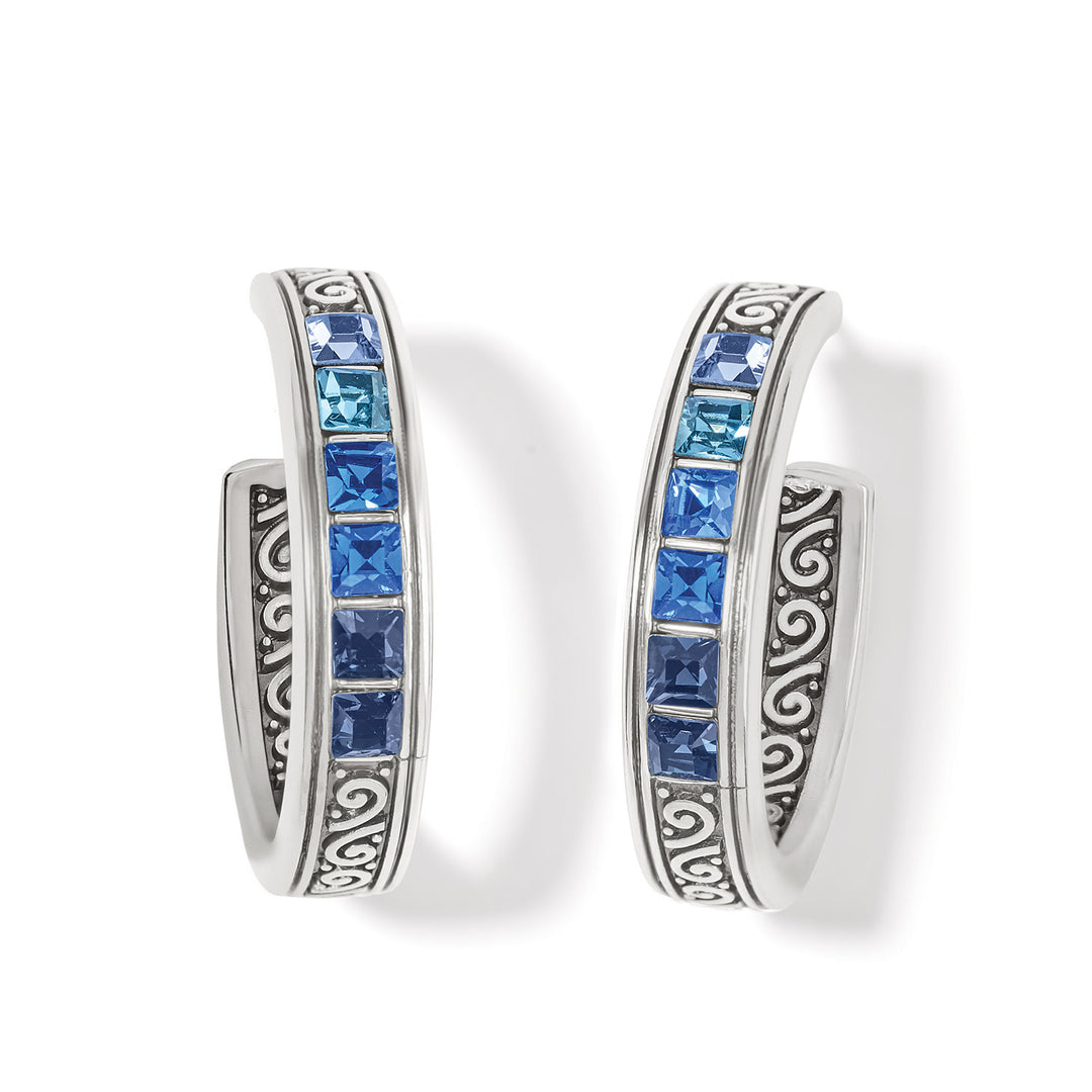 Silver plated hoop earrings with a light blue ombre spectrum of fine channel-set crystals.