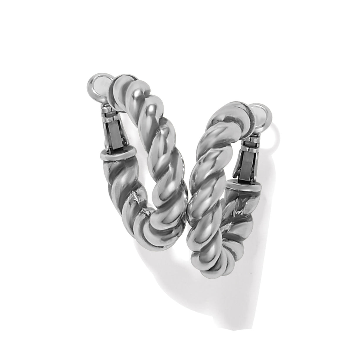Silver plated medium hoop earrings with a sculpted twist rope design inspired by Roman columns.