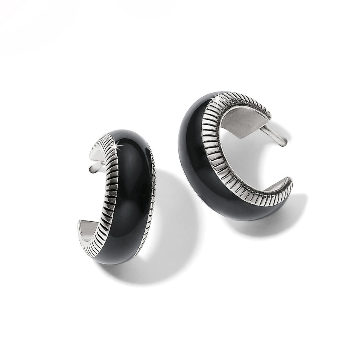Silver-plated black enamel small hoop earrings with fine textured lines.