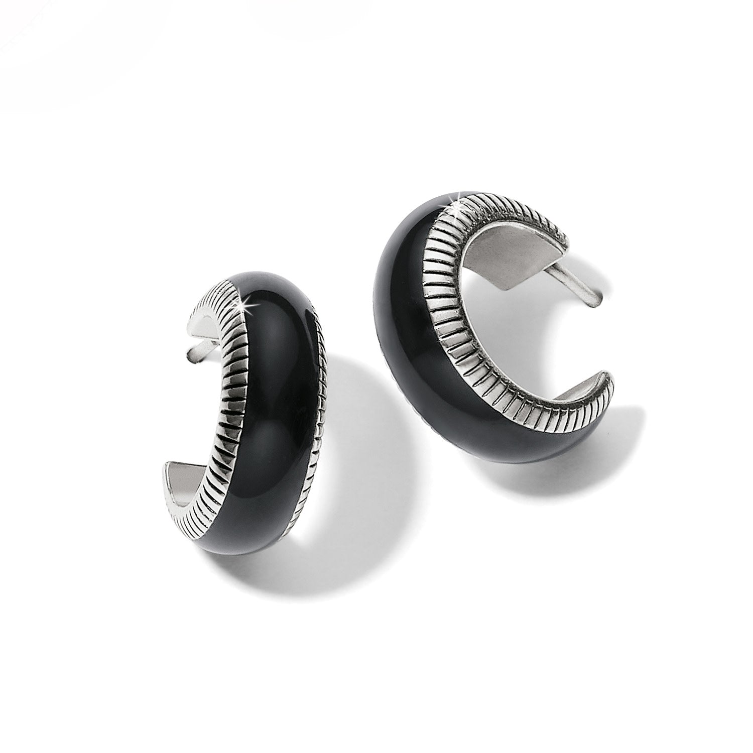 Silver-plated black enamel small hoop earrings with fine textured lines.