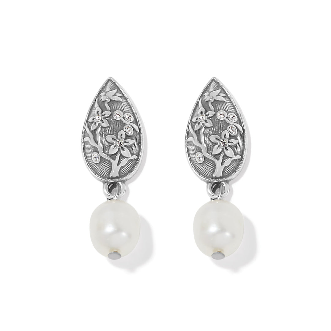 Silver post earrings with dimensional cherry blossom relief patterns accented by natural freshwater pearls.