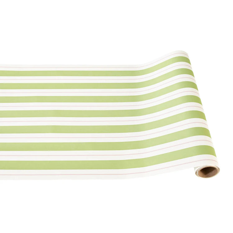 A roll of white paper table runner with horizontal light green awning stripes.