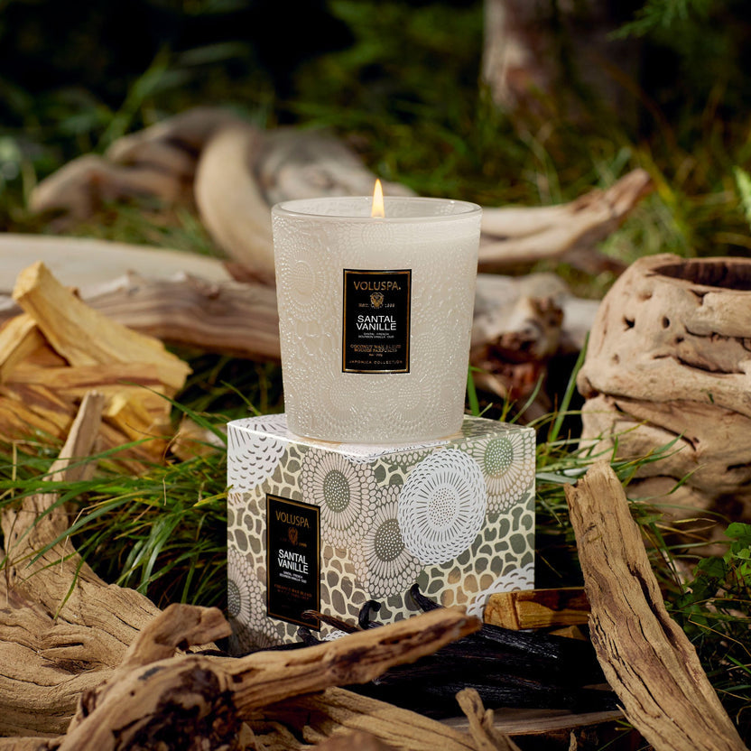 Santal Vanille classic candle in a cylindrical glass jar with a black lid.