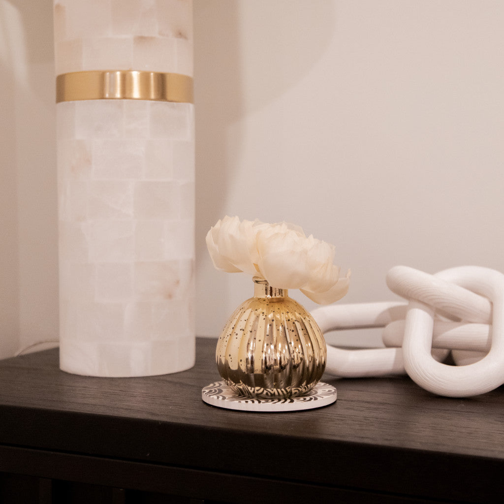 Sweet Grace Holiday Flower Diffuser in a gold mercury glass vase on a dark wood surface.