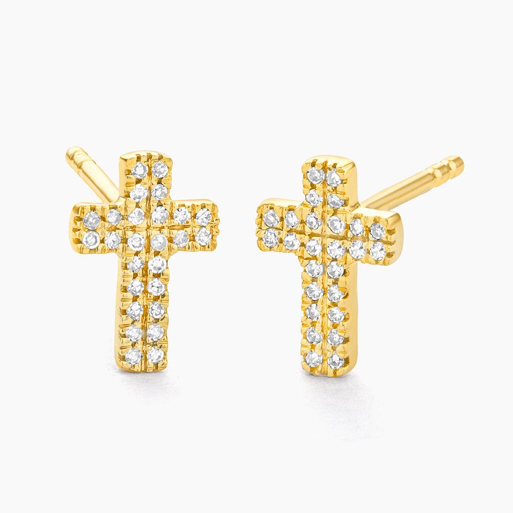 Small diamond stud earrings with a cross-shaped setting in silver-tone metal.