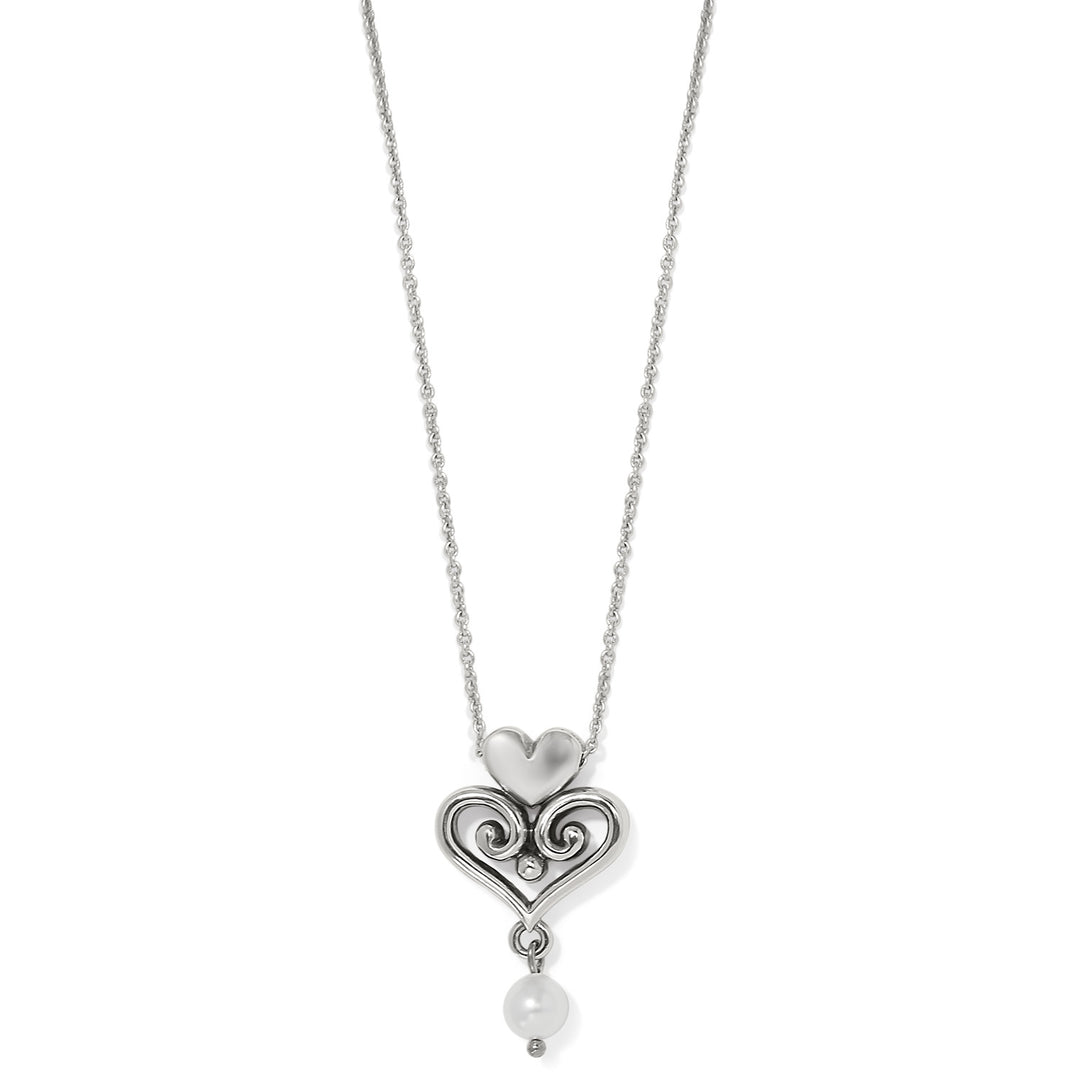 Alcazar Amor silver-plated necklace featuring a heart pendant with scrollwork and a pearl drop.