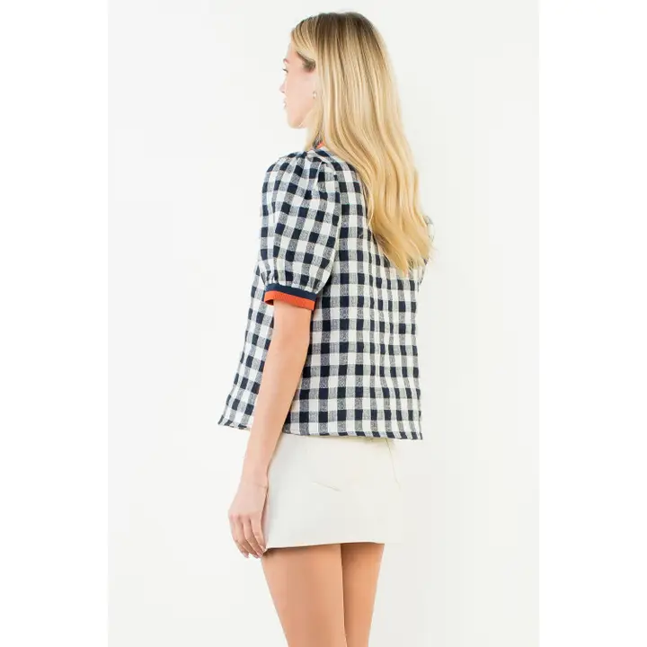 Navy checkered puff sleeve V-neck top with a relaxed fit.