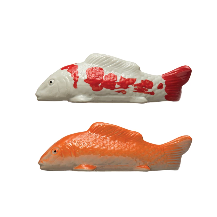 8-inch stoneware floating fish sculpture in natural earth tones with a smooth silhouette.