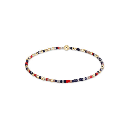 Hope Unwritten bracelet featuring mixed seed beads in various colors with gold-filled accents on elastic cord.