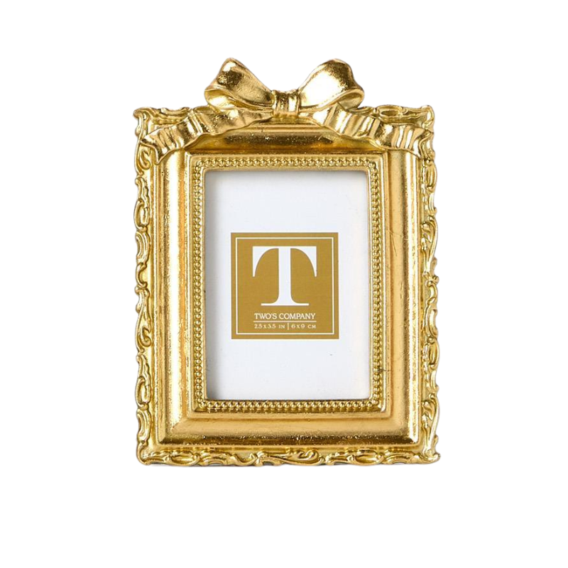 Gold mini photo frame with ornate edges and a decorative bow on top.
