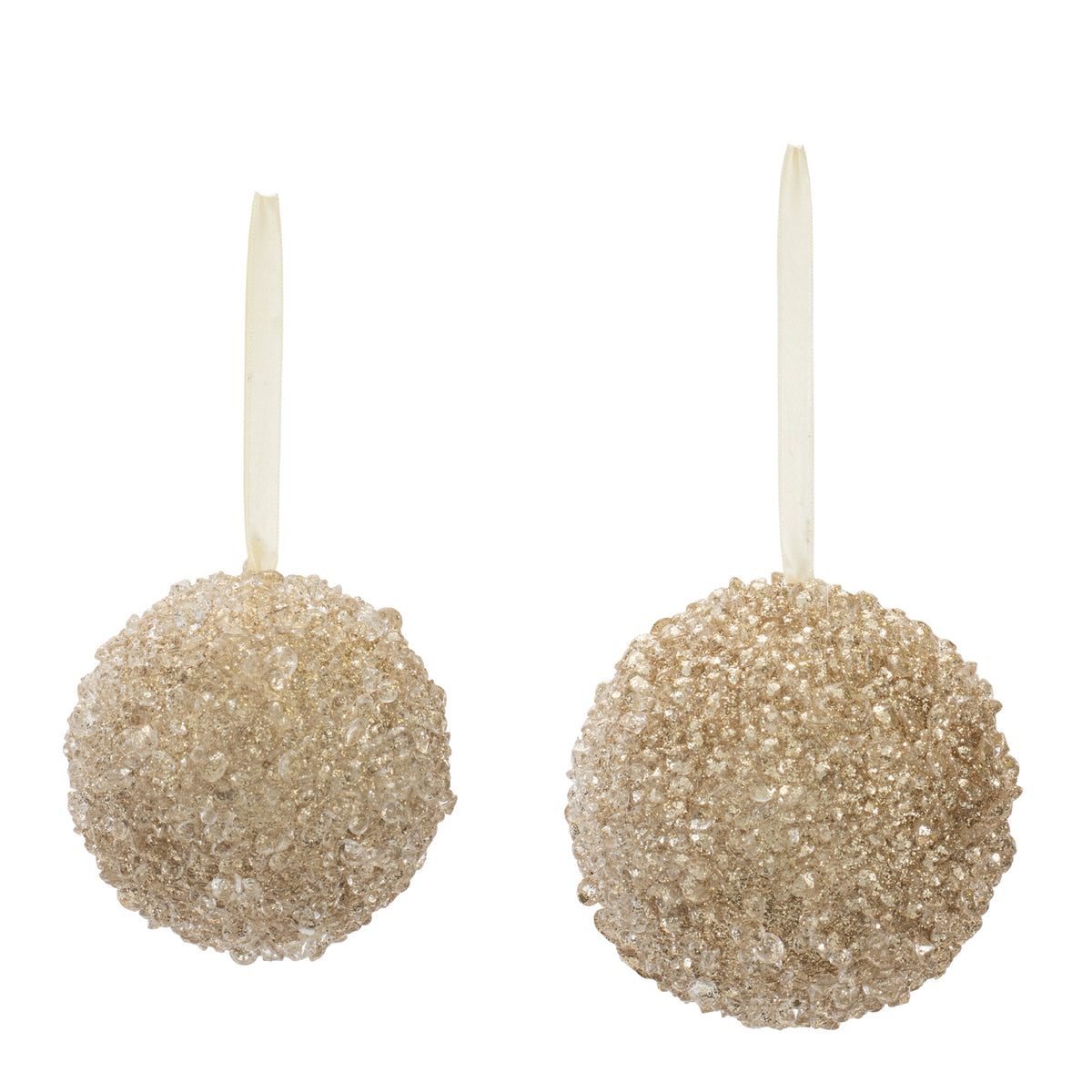 Two champagne gold beaded ball ornaments with hanging ribbons on a white background.