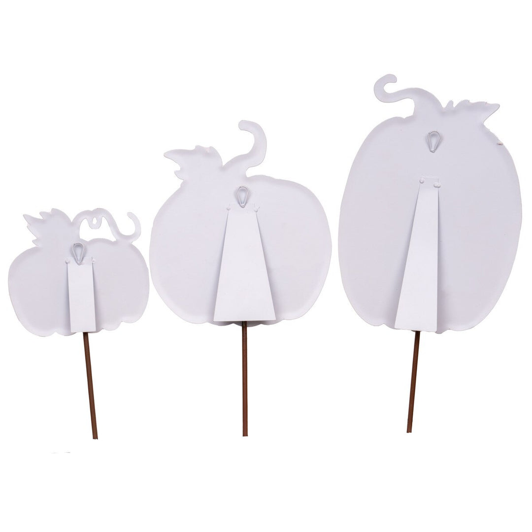 Back view of three white watercolor pumpkin decorations with stakes, easels, and hanging loops.