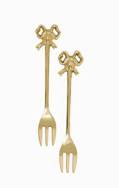 Set of two bow-shaped appetizer forks with a brushed aluminum finish on a backer card.