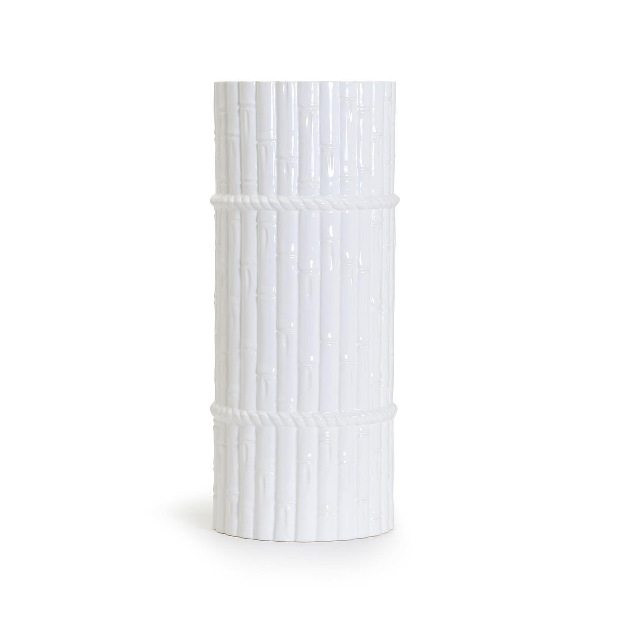Ceramic umbrella stand with bamboo fretwork holding greenery branches