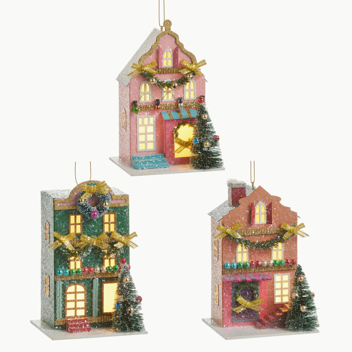 Three 5.5-inch lighted paper house ornaments in pink, green, and orange with festive decorations.