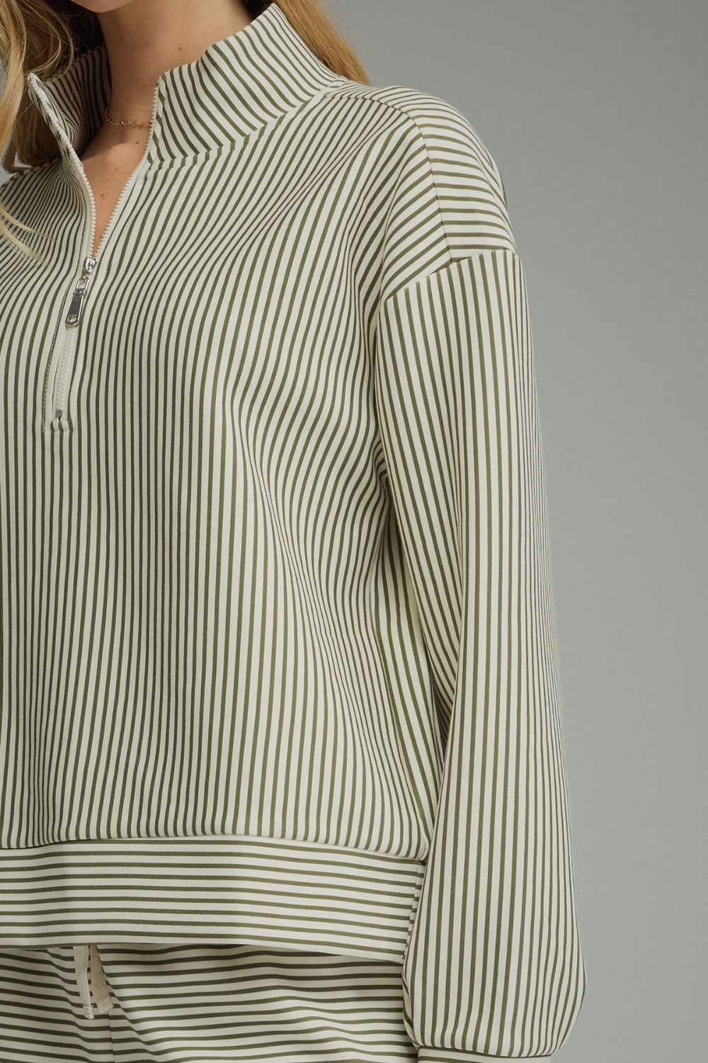 Melissa Stripe Long Sleeve Knit Top with olive green and white stripes and a quarter-zip front.