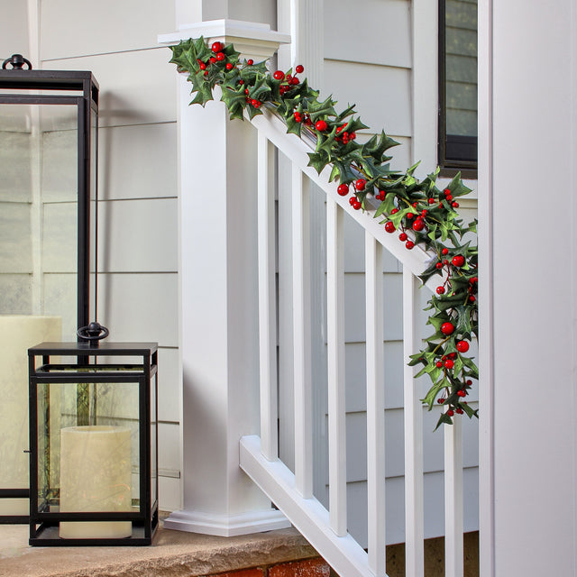 48-inch Pacific Northwest holly and red berry garland draped along a white porch banister.