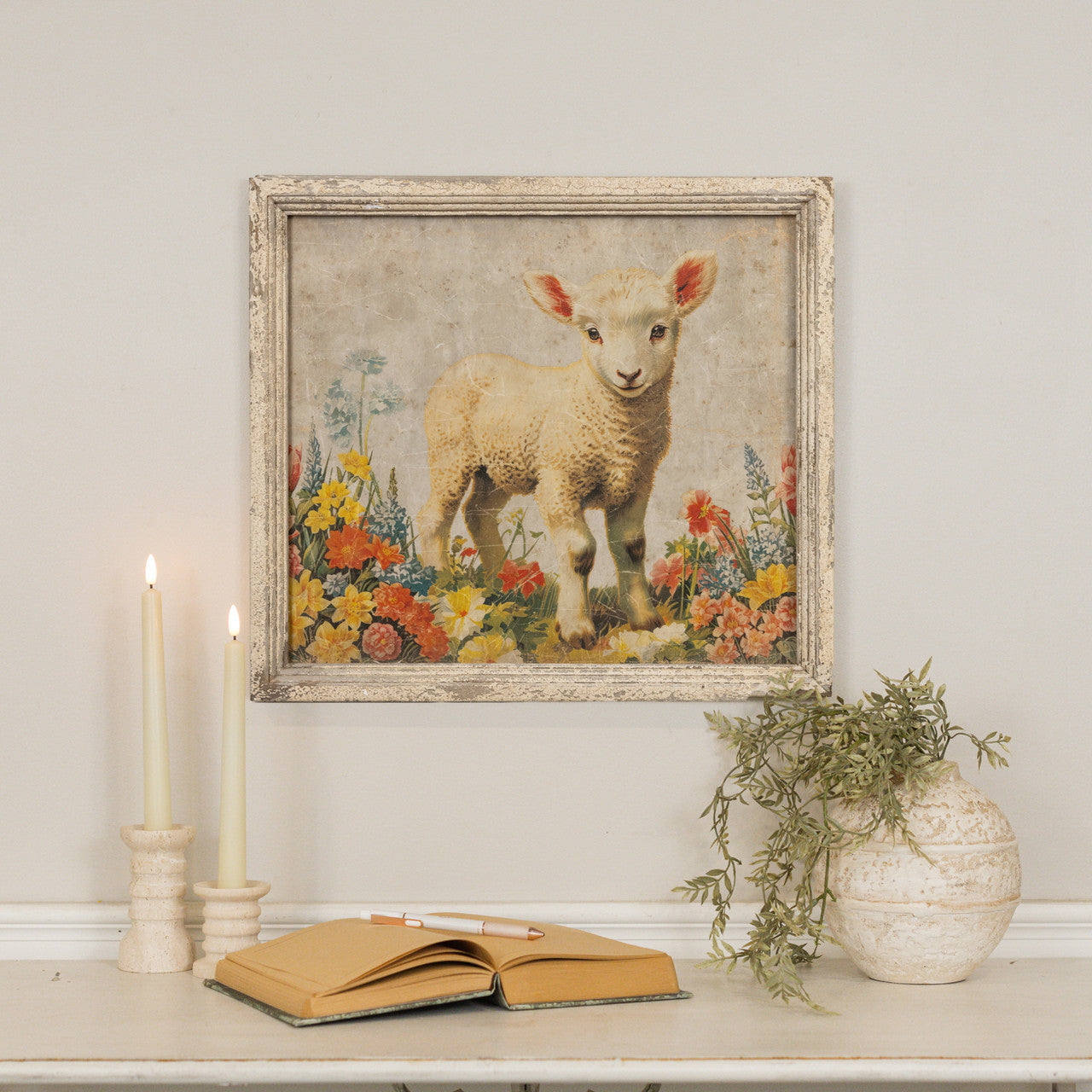 Framed baby lamb print on glass with wood frame; white background.