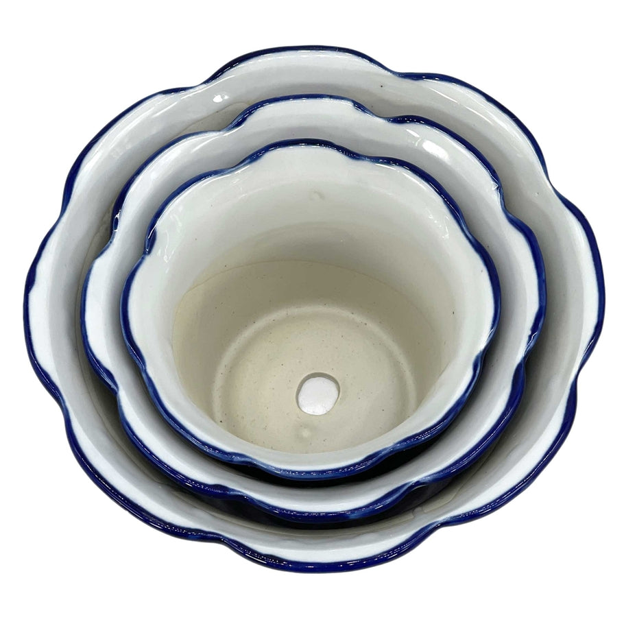 Blue and white floral ceramic pot with ruffled lip style