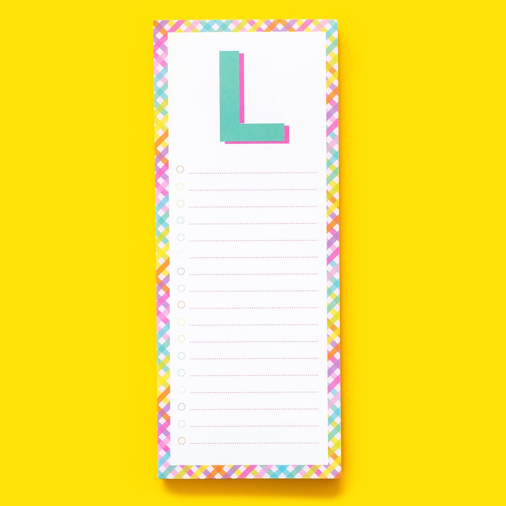 List Pad Letters: white lined notepad with a magnet on the back.
