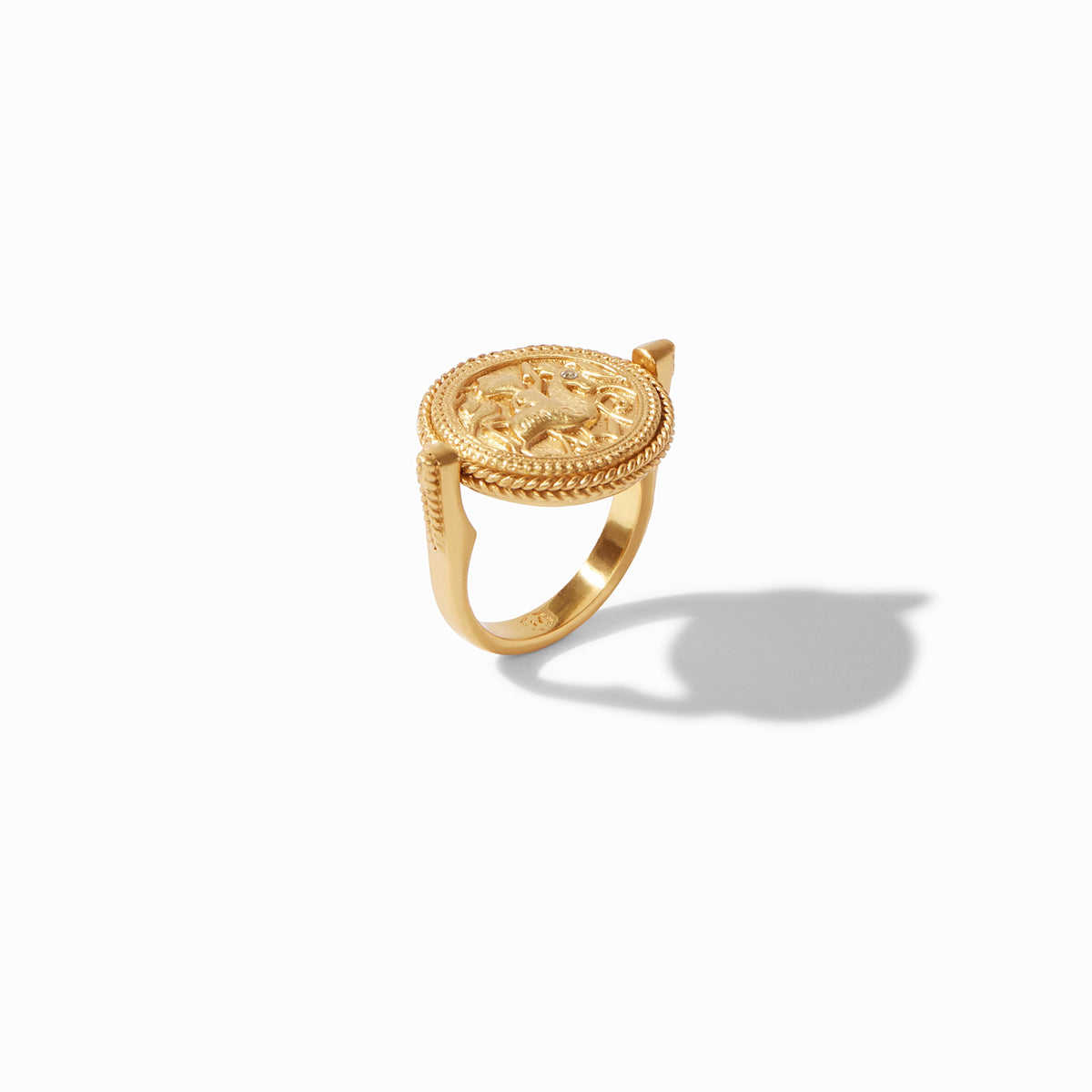 Gold-plated revolving coin ring with an intricate relief design and a twisted rope border.