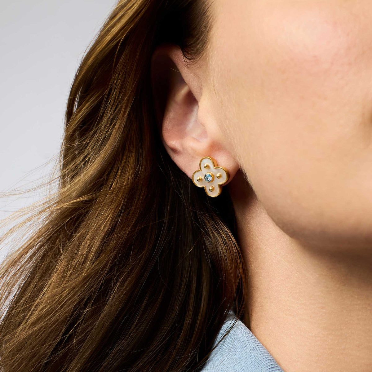Colette Stud earrings featuring a mother-of-pearl center with CZ accents on gold-plated posts.