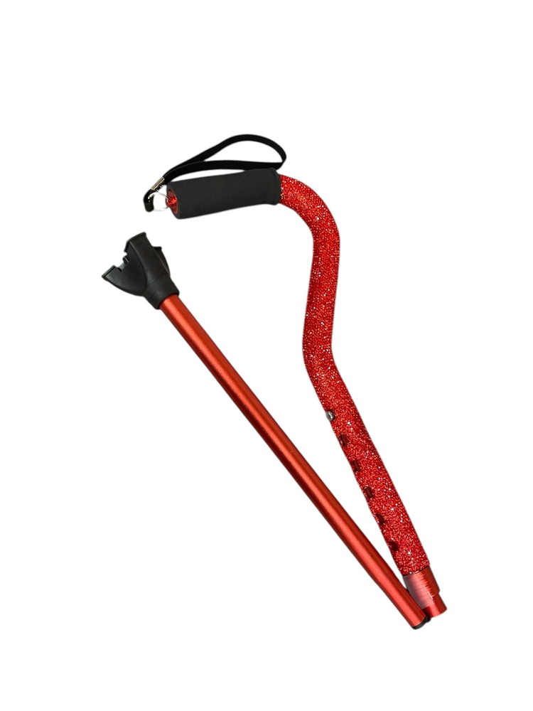 Red rhinestone-covered adjustable walking cane with a black foam grip and wrist strap.