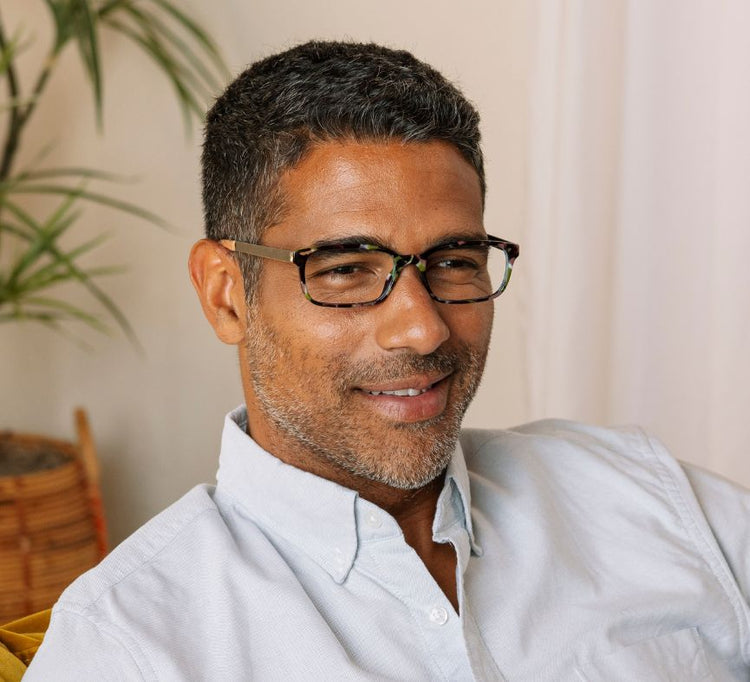 Man wearing Memphis rectangular tortoiseshell glasses with blue light filtering lenses.
