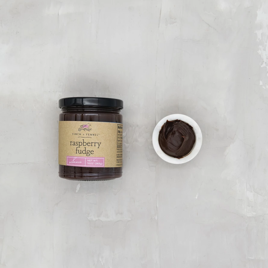 Bottle of raspberry fudge sauce with chocolate swirls