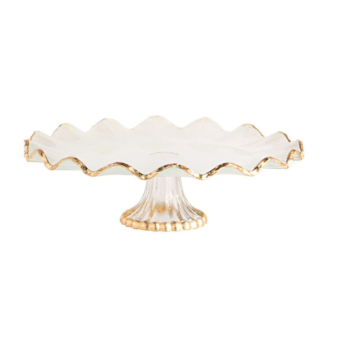 Glass cake stand with a gold foil ruffle edge and a ribbed pedestal base.