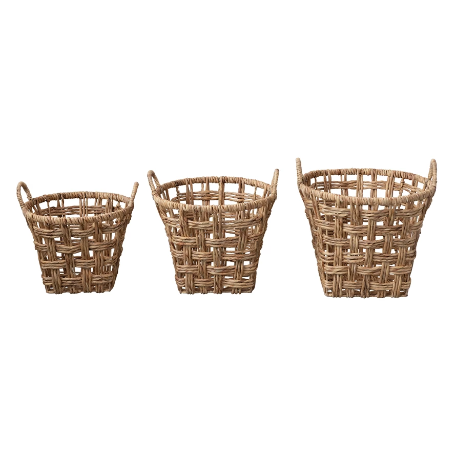 Hand-woven water hyacinth basket with twisted handles in natural beige tones.