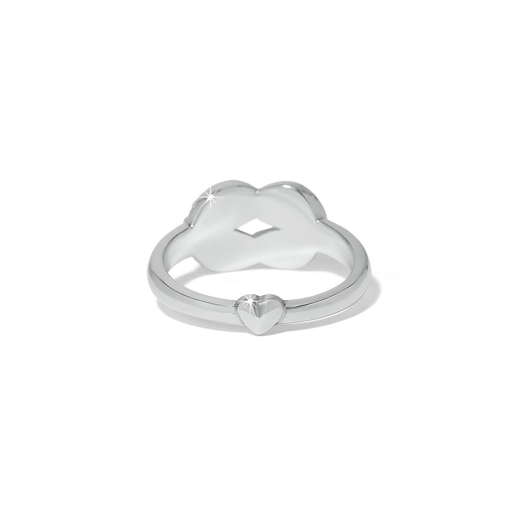 Silver plated ring with fine quality crystals in a wide band setting.