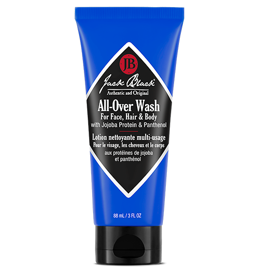 Bottle of All-Over Wash with jojoba protein and panthenol in a clear container.