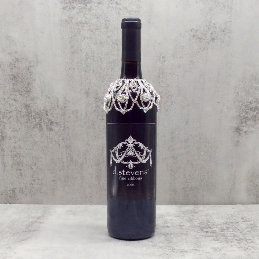 5-inch small crystal wine collar with sparkling rhinestone loops on a dark wine bottle.