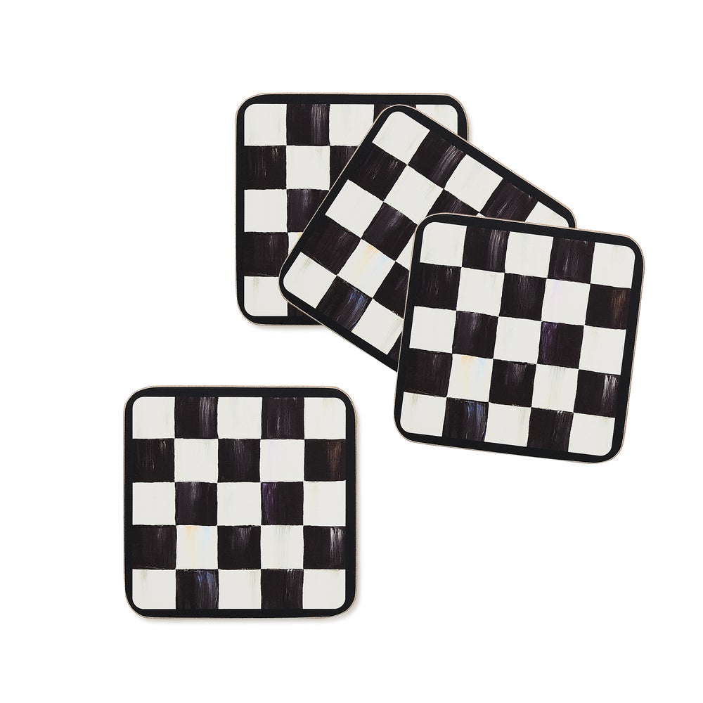 Set of four square coasters with a hand-painted black and white checkered pattern and cork backing.