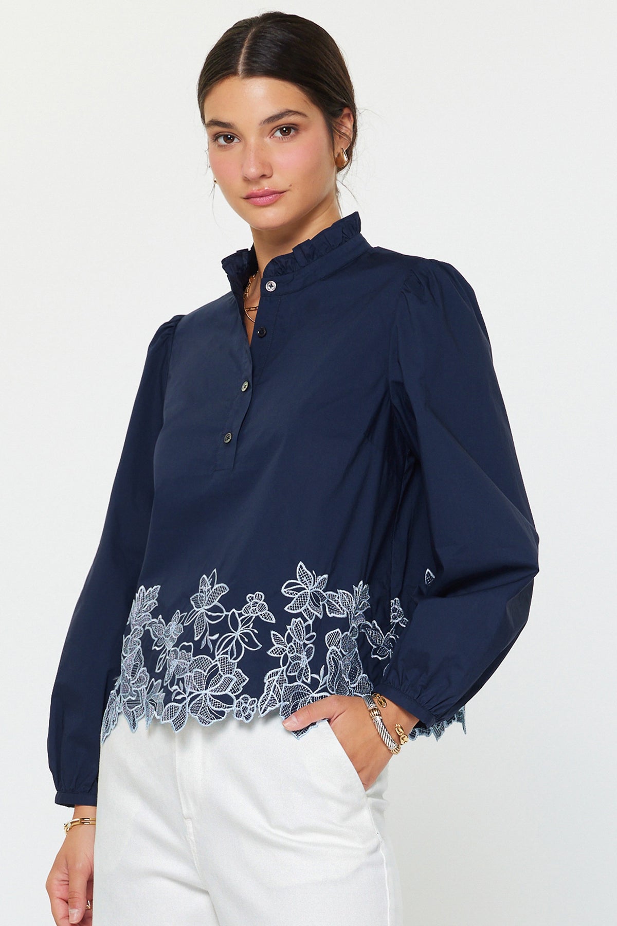 Lucy embroidered long sleeve blouse in white cotton poplin with ruffle stand collar and floral hem detail