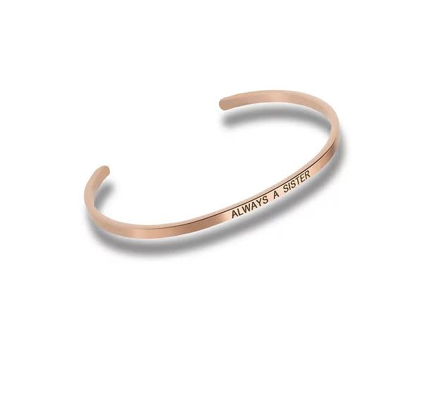 Rose gold cuff bracelet engraved with the words ALWAYS A SISTER.