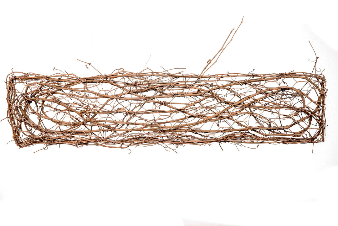 36-inch grapevine door decor in natural brown with a vertical vine silhouette.