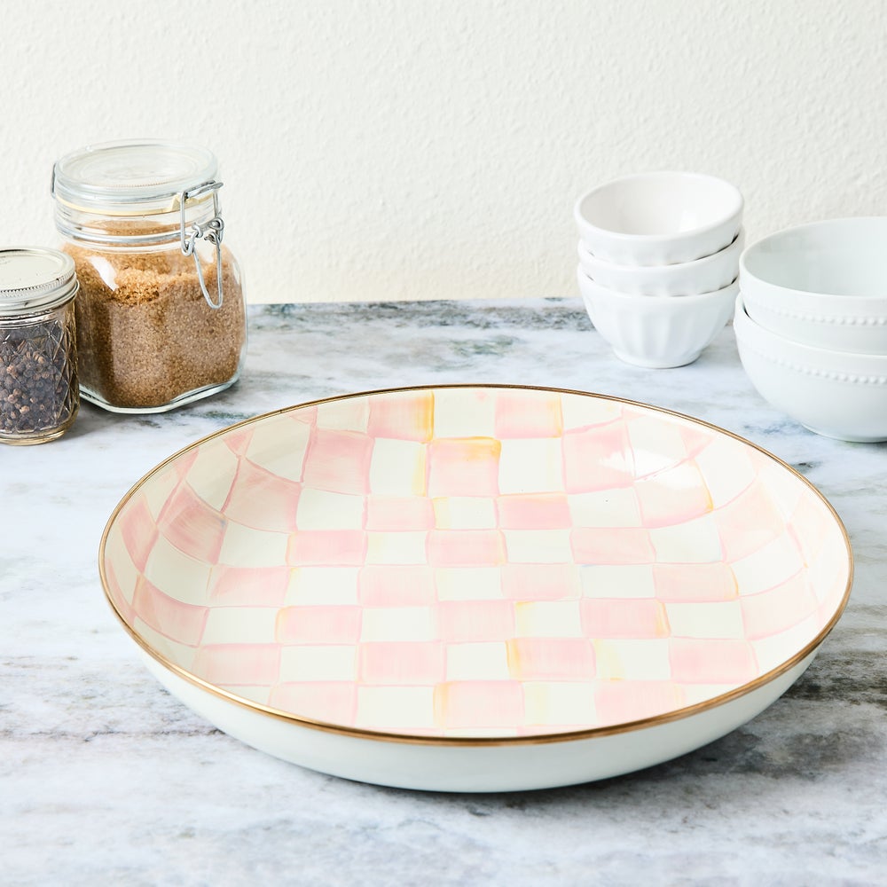 Hand-glazed steel bowl with hand-painted rosy check pattern on a bronzed stainless rim.
