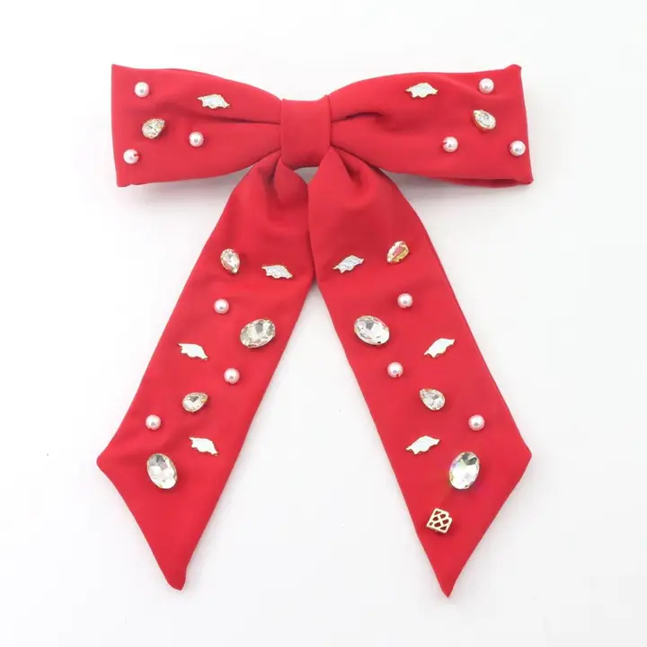 Gold barrette with University of Arkansas logo charms and hand-sewn resin pearls.